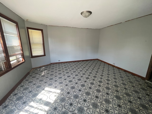 empty room featuring tile patterned floors