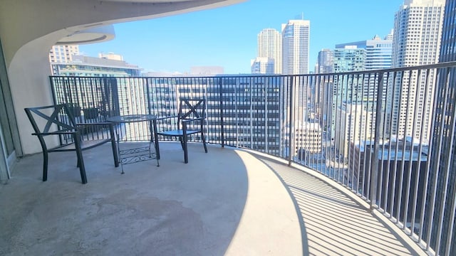 balcony featuring a view of city