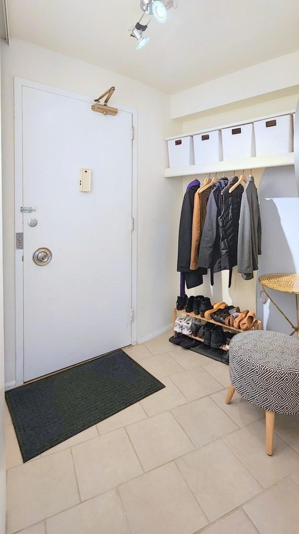 mudroom with tile patterned flooring