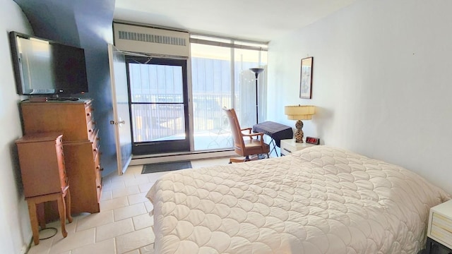 tiled bedroom with expansive windows and a baseboard heating unit