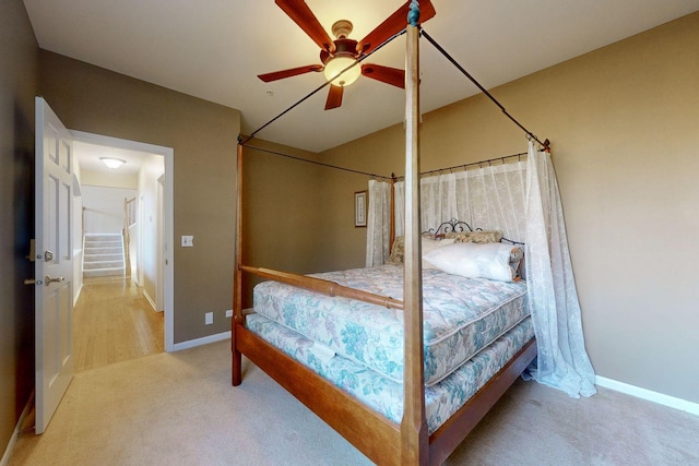 bedroom with ceiling fan and carpet flooring