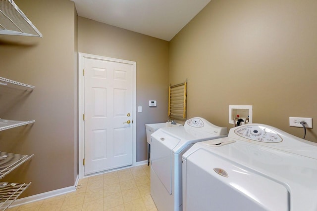 clothes washing area featuring separate washer and dryer