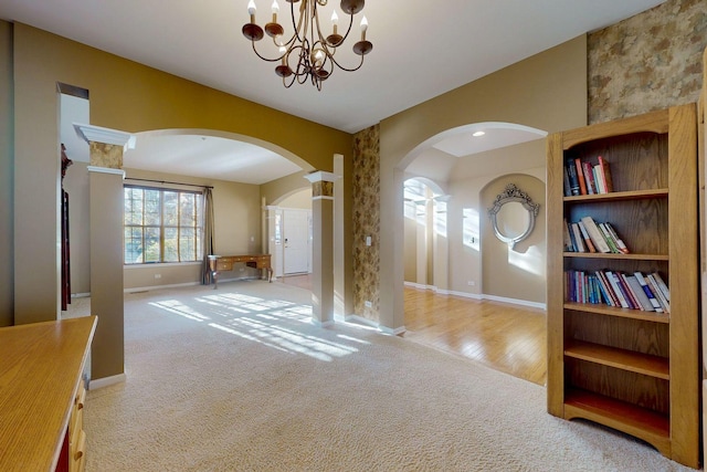 interior space with vaulted ceiling and a notable chandelier