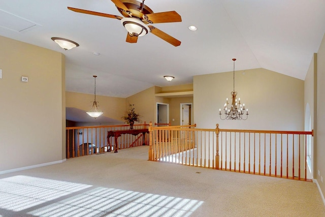 interior space with vaulted ceiling and carpet