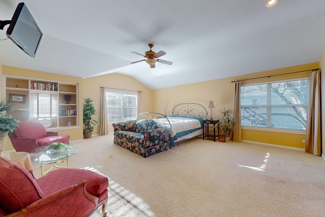 carpeted bedroom featuring lofted ceiling and ceiling fan