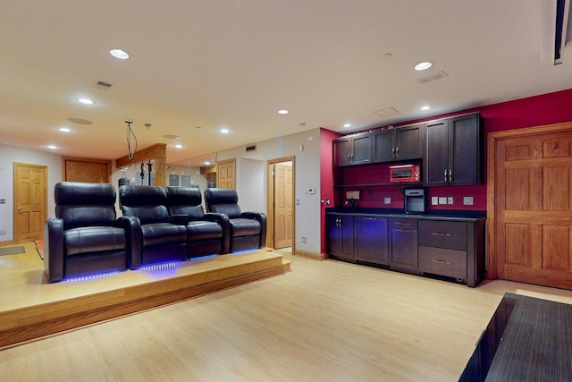 interior space with pendant lighting and light hardwood / wood-style floors