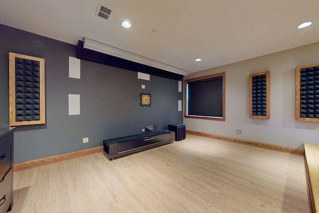 home theater room with light hardwood / wood-style floors