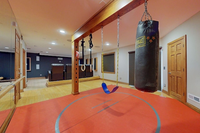 workout room featuring basketball court