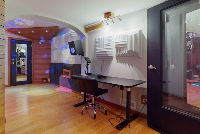 home office with hardwood / wood-style flooring