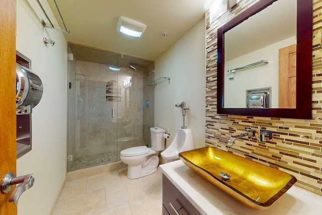 bathroom featuring toilet, a shower with shower door, tasteful backsplash, vanity, and tile patterned flooring