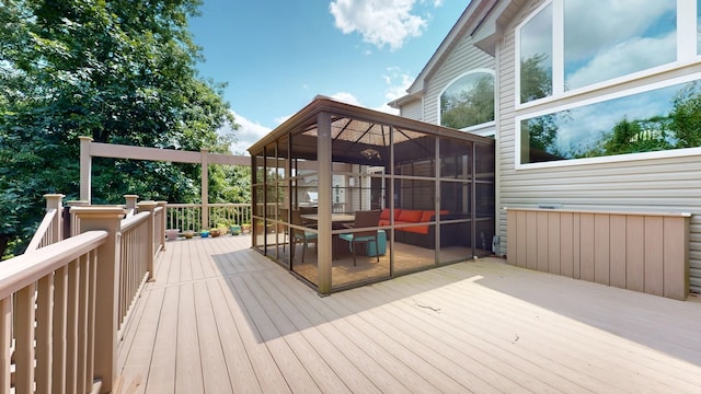 wooden terrace featuring a sunroom