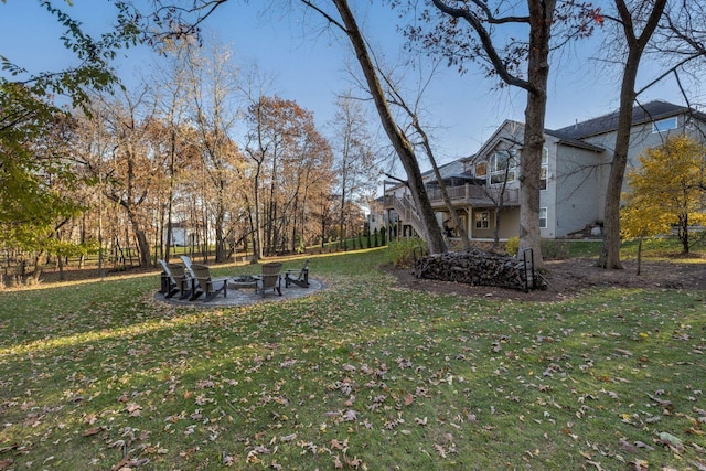 view of yard with a balcony and a patio