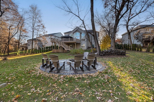 view of yard with an outdoor fire pit, a deck, and a patio area