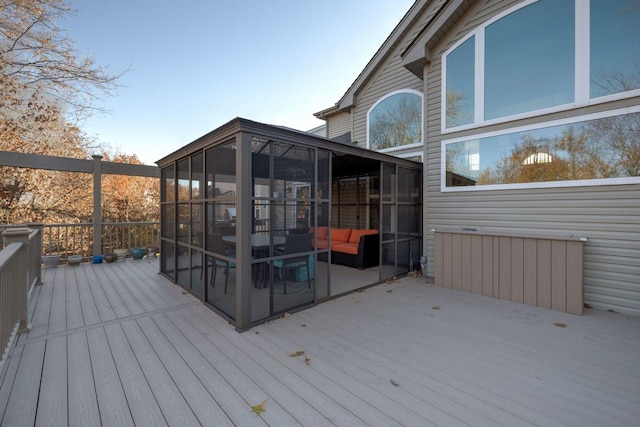 wooden terrace featuring a sunroom