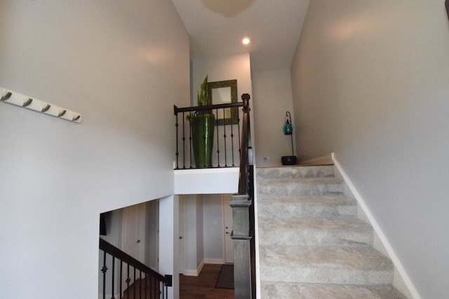 stairway featuring wood-type flooring