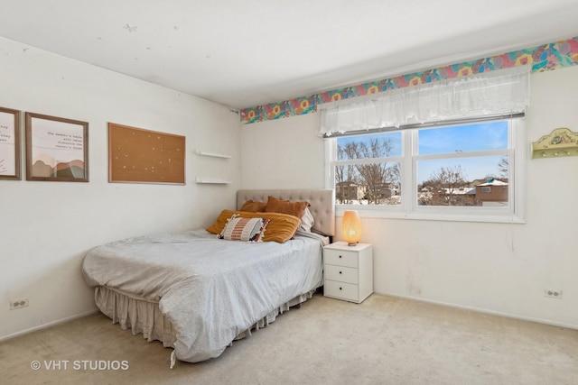 bedroom with light colored carpet