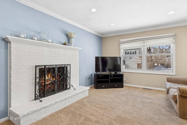 carpeted living area with recessed lighting, a fireplace, visible vents, baseboards, and crown molding