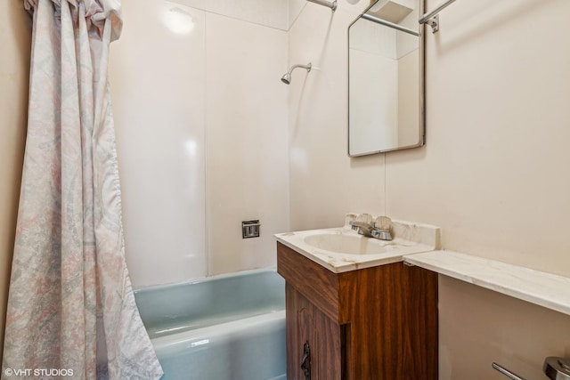 bathroom featuring vanity and shower / bath combo with shower curtain