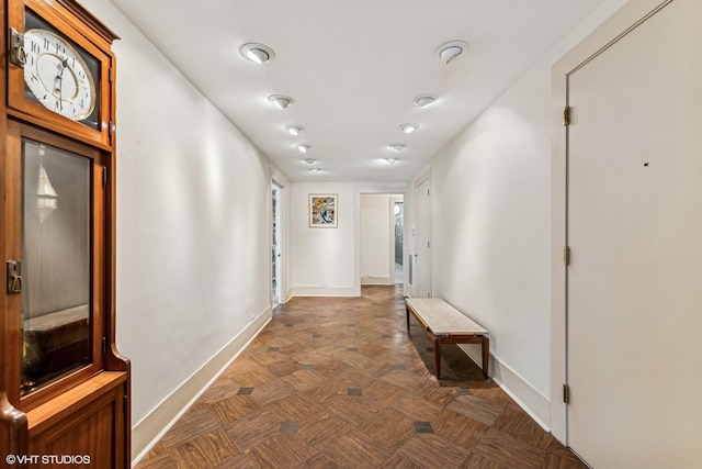 corridor featuring dark parquet floors