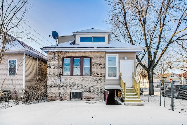 view of snow covered house