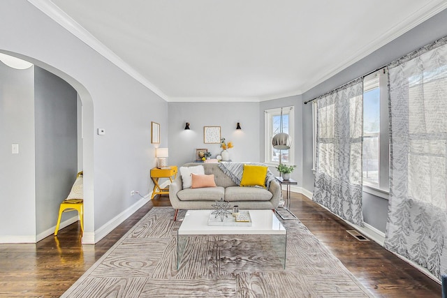 living room with ornamental molding and dark hardwood / wood-style flooring