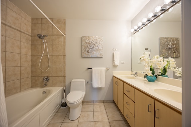 full bathroom featuring tiled shower / bath combo, double vanity, toilet, and tile patterned flooring