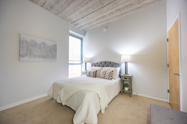 bedroom with light colored carpet