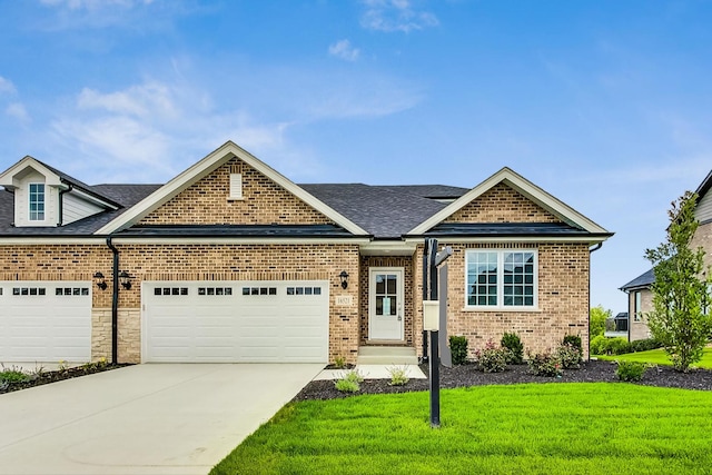 craftsman inspired home with a front yard and a garage