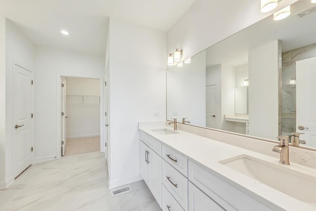 bathroom with double vanity and tile patterned flooring