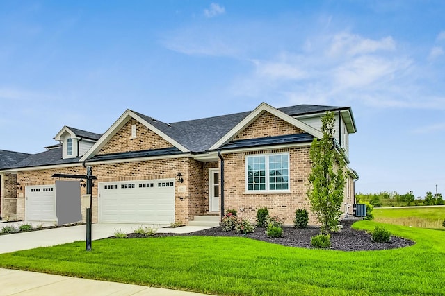 craftsman-style house featuring a garage, cooling unit, and a front lawn