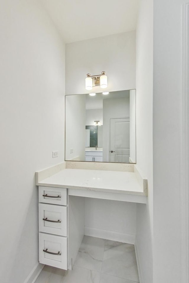 bathroom with tile patterned floors and vanity