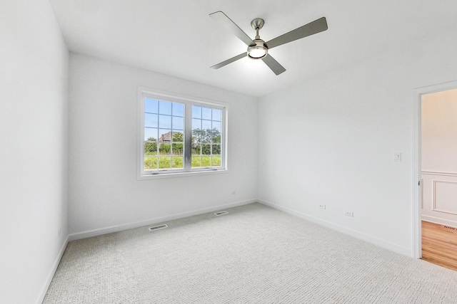 spare room with ceiling fan and hardwood / wood-style floors