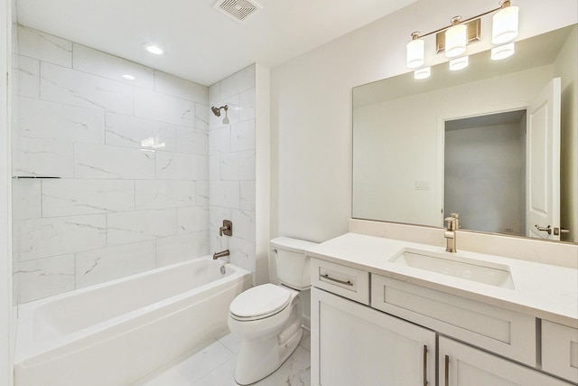 full bathroom featuring toilet, tiled shower / bath combo, vanity, and tile patterned floors