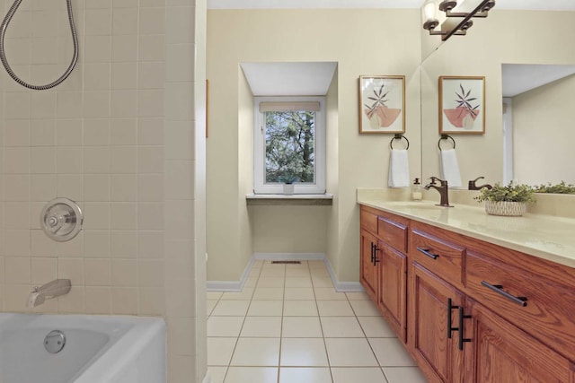 bathroom featuring tile patterned flooring, vanity, and tiled shower / bath combo