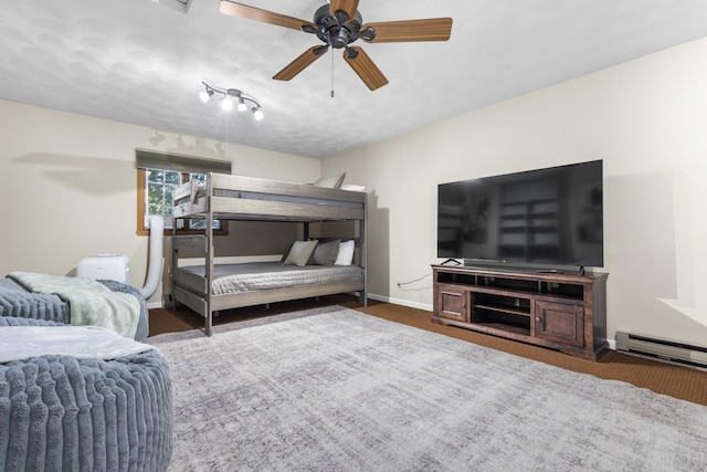 bedroom featuring ceiling fan and a baseboard radiator