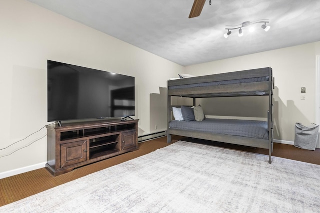 bedroom featuring ceiling fan and baseboard heating