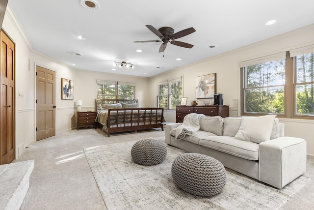 carpeted bedroom featuring crown molding