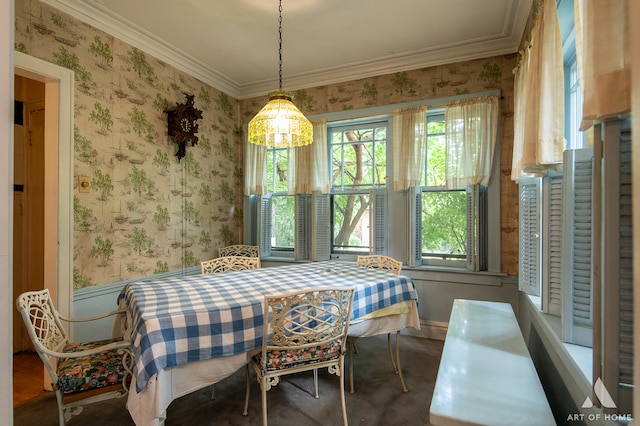 dining area featuring plenty of natural light and ornamental molding