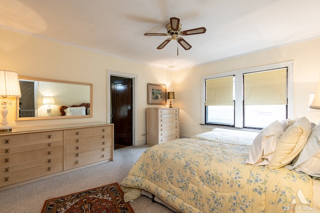 bedroom with ceiling fan, ornamental molding, and light carpet