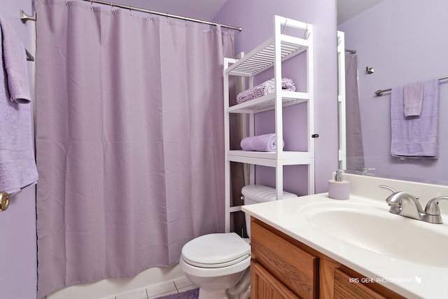 full bathroom with vanity, toilet, shower / bathtub combination with curtain, and tile patterned floors