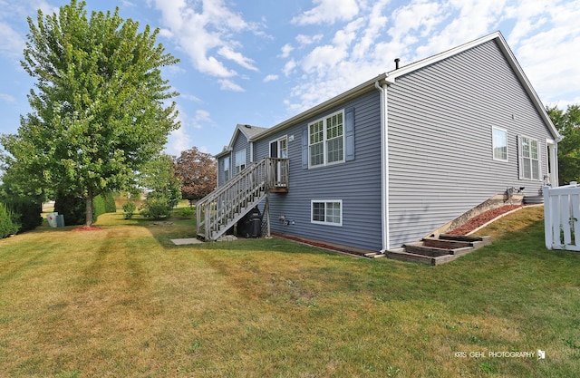 1214 Jerome Ct E, Antioch, IL 60002 - view of home's exterior featuring a lawn, stairs, and central AC