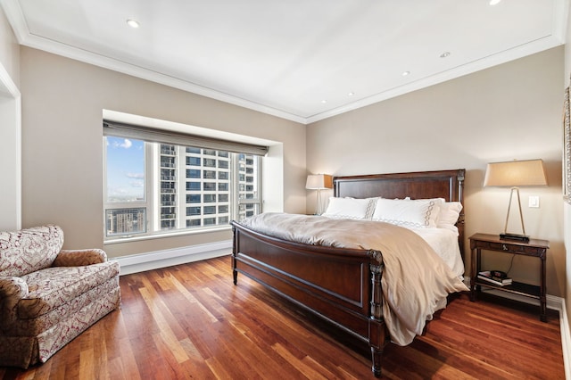 bedroom featuring dark hardwood / wood-style flooring and ornamental molding