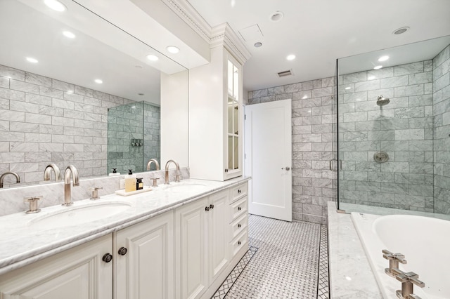 bathroom with vanity, tile walls, separate shower and tub, and tile patterned floors