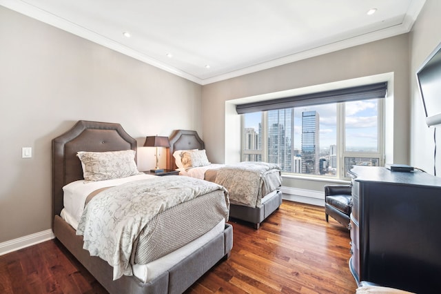 bedroom with dark wood-type flooring and ornamental molding