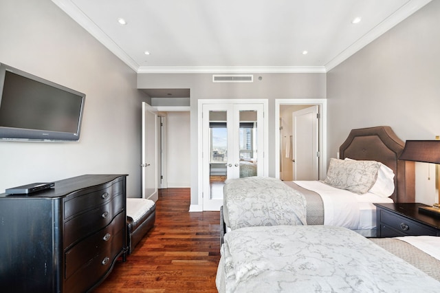 bedroom featuring dark hardwood / wood-style flooring, crown molding, and french doors