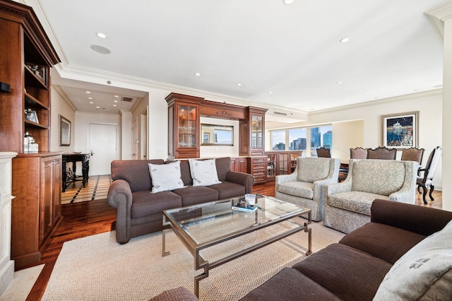 living room featuring crown molding and hardwood / wood-style floors