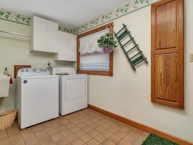 laundry area with cabinets, light tile patterned floors, and independent washer and dryer