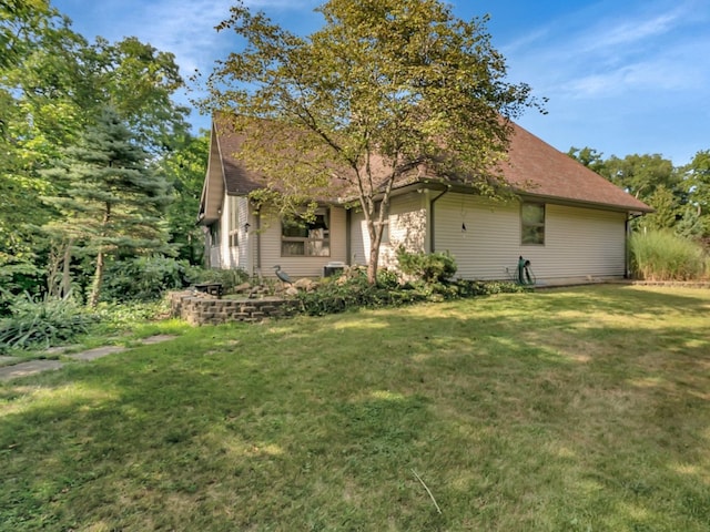 view of property exterior with a yard