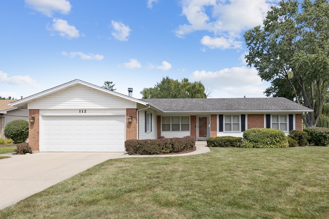 single story home featuring a garage and a front yard