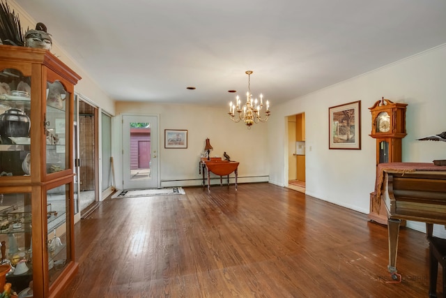 dining area featuring an inviting chandelier, dark wood-type flooring, and a baseboard radiator